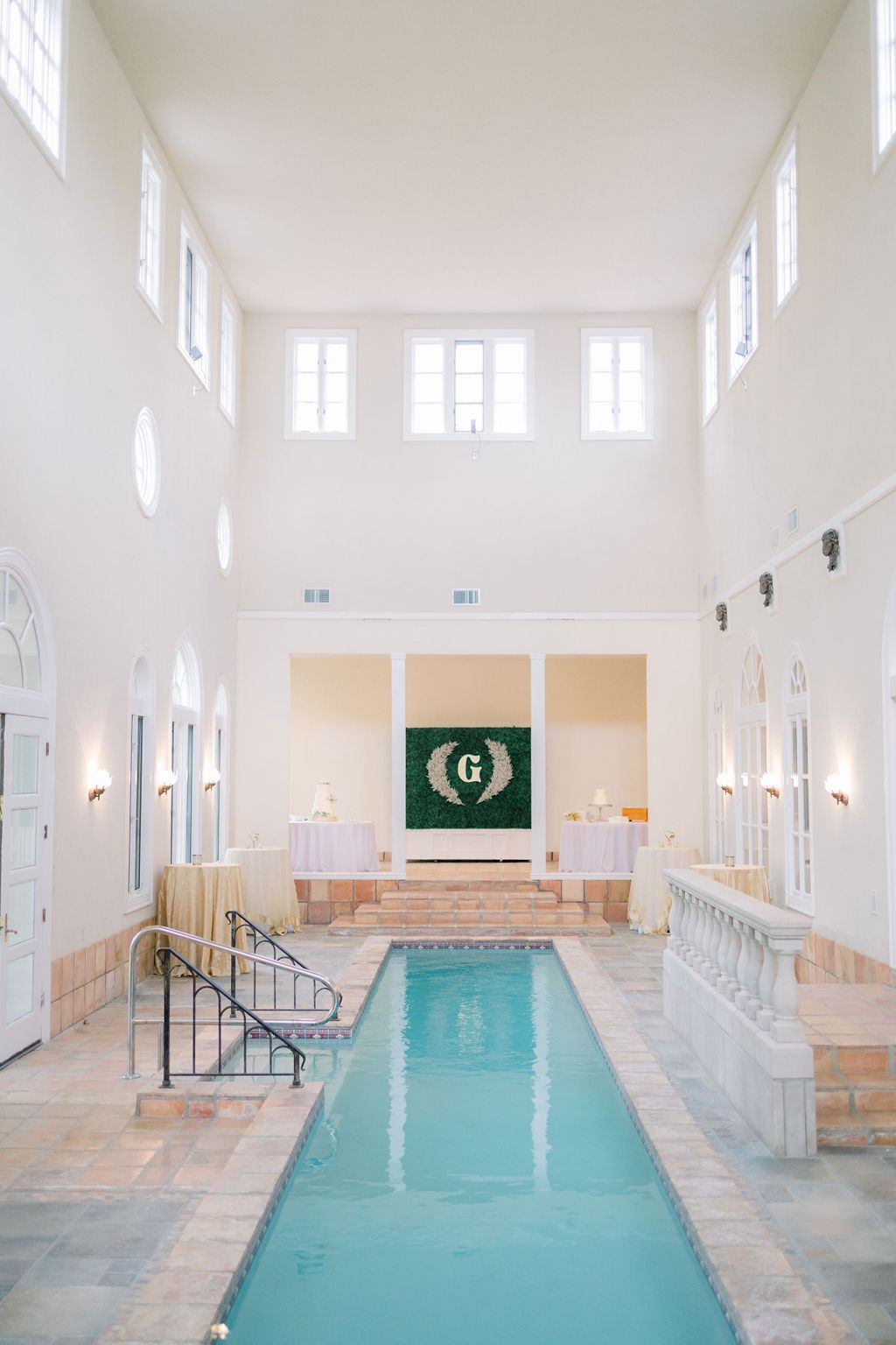 Large indoor pool with Italian style architecture.
