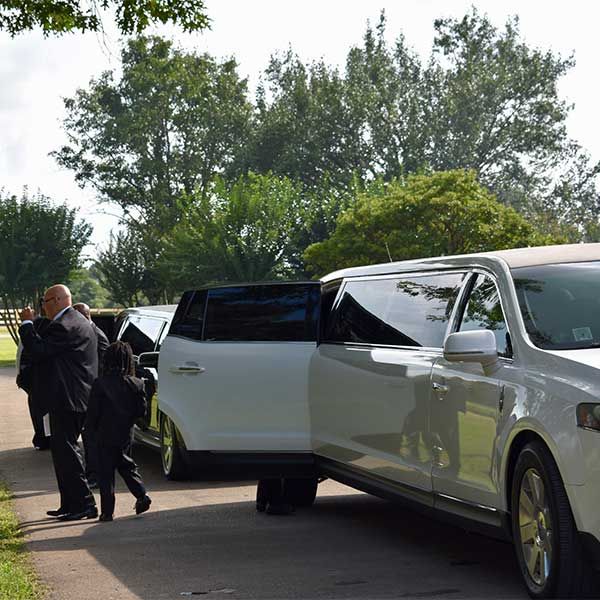 The groomsmen are exiting the limosene