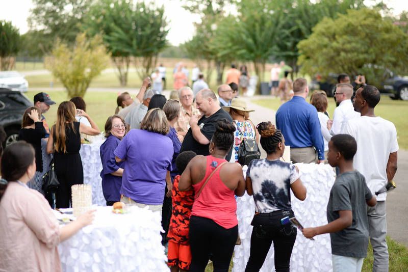 Photo of a large outdoor corporate party.