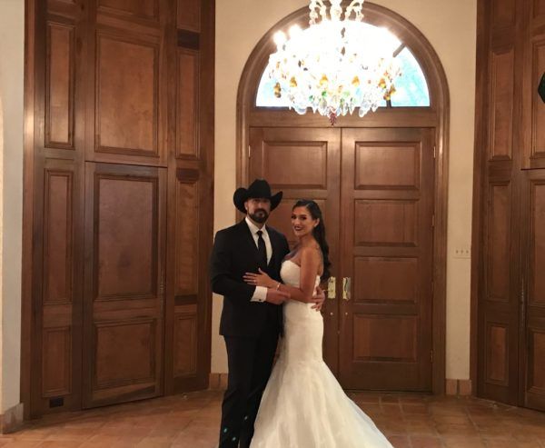 Bride and Groom at the doorway at Tuscan Ridge.